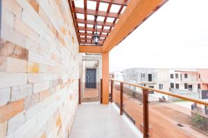 a balcony with a view of a building at Luxurious townhouse behind Achimota Mall in Accra