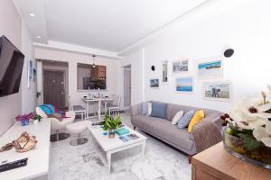 a living room with a couch and a table at Azur in Gammarth