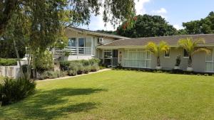 a house with a large lawn in front of it at Avillahouse Guesthouse in Durban