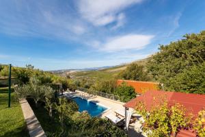 an overhead view of a swimming pool in a garden at HIDDEN PARADISE - Villa by Split in Žrnovnica