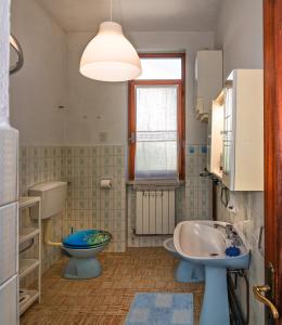 a bathroom with a sink and a toilet at Eco B&B I Due Oleandri in Marina di Carrara
