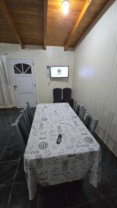 a table and chairs in a room with a table at Obera Departamento Hasta 4 Personas in Oberá