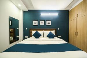 Ένα ή περισσότερα κρεβάτια σε δωμάτιο στο Hotel O Royal Discovery