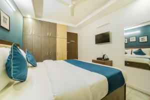 Ένα ή περισσότερα κρεβάτια σε δωμάτιο στο Hotel O Royal Discovery +23 φωτογραφίες