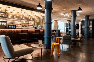 O zonă de relaxare la Ibis Styles Lyon Villeurbanne Parc de la Tête d'Or