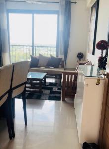 a living room with a couch and a table at Oval View Residence by C in Colombo