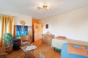 a bedroom with a bed and a dresser at Ferienwohnung Spiritbalance in Sasbachwalden