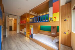a childs room with two bunk beds and a lego house at Leng x Vuishare - Ecopark with working space in Kim Quan