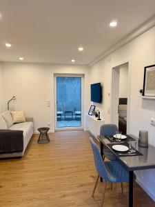 a living room with a couch and a table at NNN - NigelNagelNeu in Celle