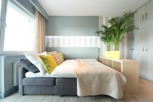 Posteľ alebo postele v izbe v ubytovaní ActivPark Apartments