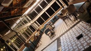 a room with a bunch of chairs in a building at hotel Green view in Baharampur