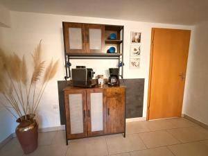 a room with a counter with a coffee maker on it at Urlaub in der Natur in Lüdenscheid