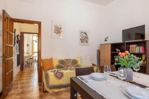 a living room with a couch and a table at Italian Experience - Casa La Conchiglia in Porto Recanati
