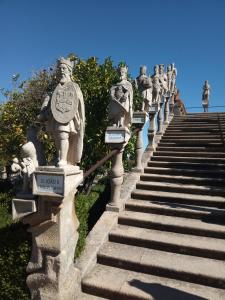 a group of statues on the side of a set of stairs at CITY CENTEr in Castelo Branco