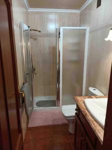 a bathroom with a shower and a toilet and a sink at WONDERFUL Sea Views El Pris in El Pris +29 photos