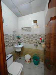 a bathroom with a toilet and a sink at Ajeem husain in Ghaziabad