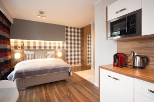 Posteľ alebo postele v izbe v ubytovaní ActivPark Apartments