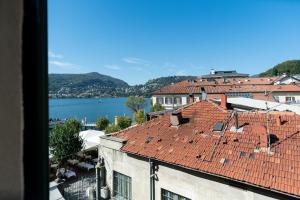 a view from a building with a red roof at MÍMESIS 11 - Boutique Hotel in Como