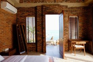 Postel nebo postele na pokoji v ubytování Pulojava Resort