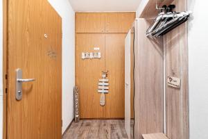 a room with a guitar on the wall next to a door at Kleine Auszeit am Meer in Büsum