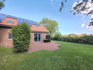 Κήπος έξω από το Komfortferienhaus Deichzauber Norddeich