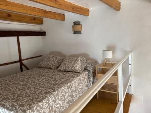 a bedroom with a bed in a room with wooden ceilings at Casita La Mercería in Güimar +13 photos