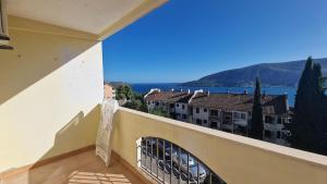 a balcony of a building with a view of the water at Mathilda's Apartment in Španjola