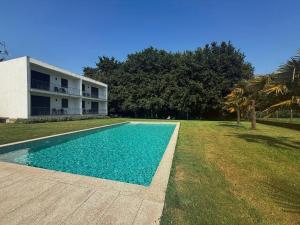 a swimming pool in front of a house at Quinta de Reiriz in Monção