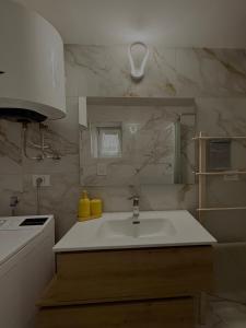a white kitchen with a sink and a stove at The Dream Home in Vieste +19 photos