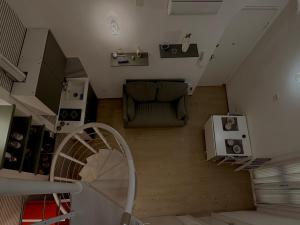 an overhead view of a living room with a couch and stairs at The Dream Home in Vieste
