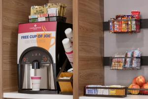 a coffee shop with a free cup of ice machine at Candlewood Suites Houston Space Center - Webster in Webster +5 photos