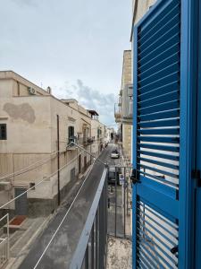 a view of a city street from a balcony at The Dream Home in Vieste