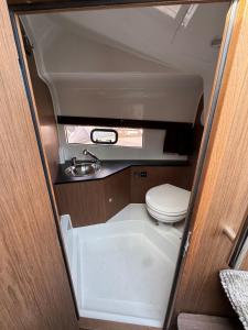 a small bathroom with a toilet and a sink at Le Rafifou Porquerolles in Hyères
