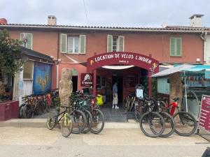 a group of bikes parked in front of a building at Le Rafifou Porquerolles in Hyères