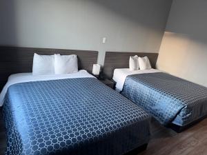 Postel nebo postele na pokoji v ubytování Champion Inn - Shepherd
