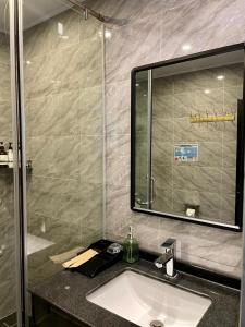 a bathroom with a sink and a mirror at Lanting Villas in Koh Rong Island +43 photos