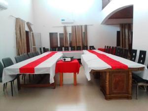 a room with two beds with red and white blankets at Océan Voyages Mitsamihouli in Mitsamiouli +27 photos