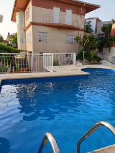 a swimming pool in front of a building at The Brushstroke Of Mágina in Bedmar