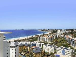 an aerial view of a city and the ocean at The Sebel Maroochydore in Maroochydore