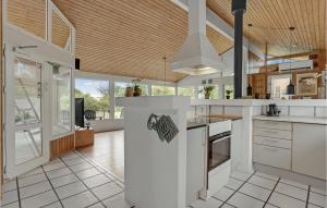 a kitchen with white countertops and a large room at Nice Home In Sydals With Wifi in Høruphav