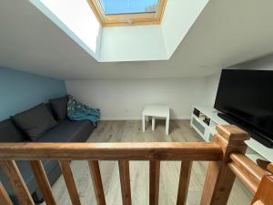 TV a/nebo společenská místnost v ubytování Chalet La Huette