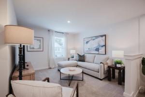 a living room with a couch and a table at Spacious Bluffton Retreat for Families & Friends in Bluffton