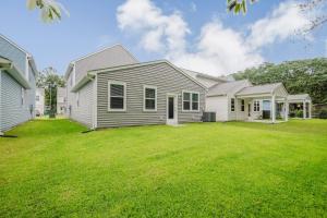 a house with a lawn in front of it at Spacious Bluffton Retreat for Families & Friends in Bluffton