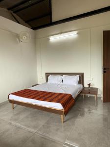 Postel nebo postele na pokoji v ubytování Nivaant Farms