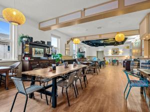 a restaurant with tables and chairs in a room at No. 1 Charlotte Street in Port Ellen