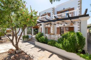 a villa with a garden in front of a house at Le Soleil De Lindos - Luxury Villa with Swim Spa in Líndos