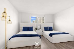 Ένα ή περισσότερα κρεβάτια σε δωμάτιο στο Modern Hollywood Beach Escape - City Views +37 φωτογραφίες