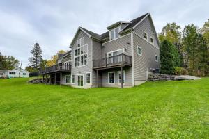 a large house with a large grass yard at Steps From Oneida Lake Spacious Gem with Game Room! in Cicero