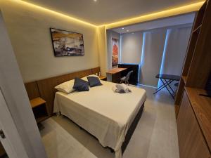 a bedroom with a bed in a room at Lofts | Consolação | 3 min Metrô in Sao Paulo