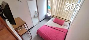 Ένα ή περισσότερα κρεβάτια σε δωμάτιο στο Hotel Castilla